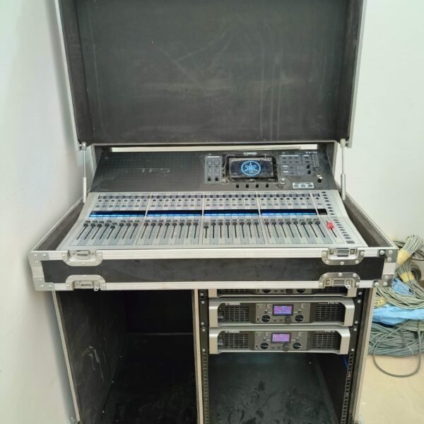 Digital mixing console and rack amplifiers powering the hall's sound system