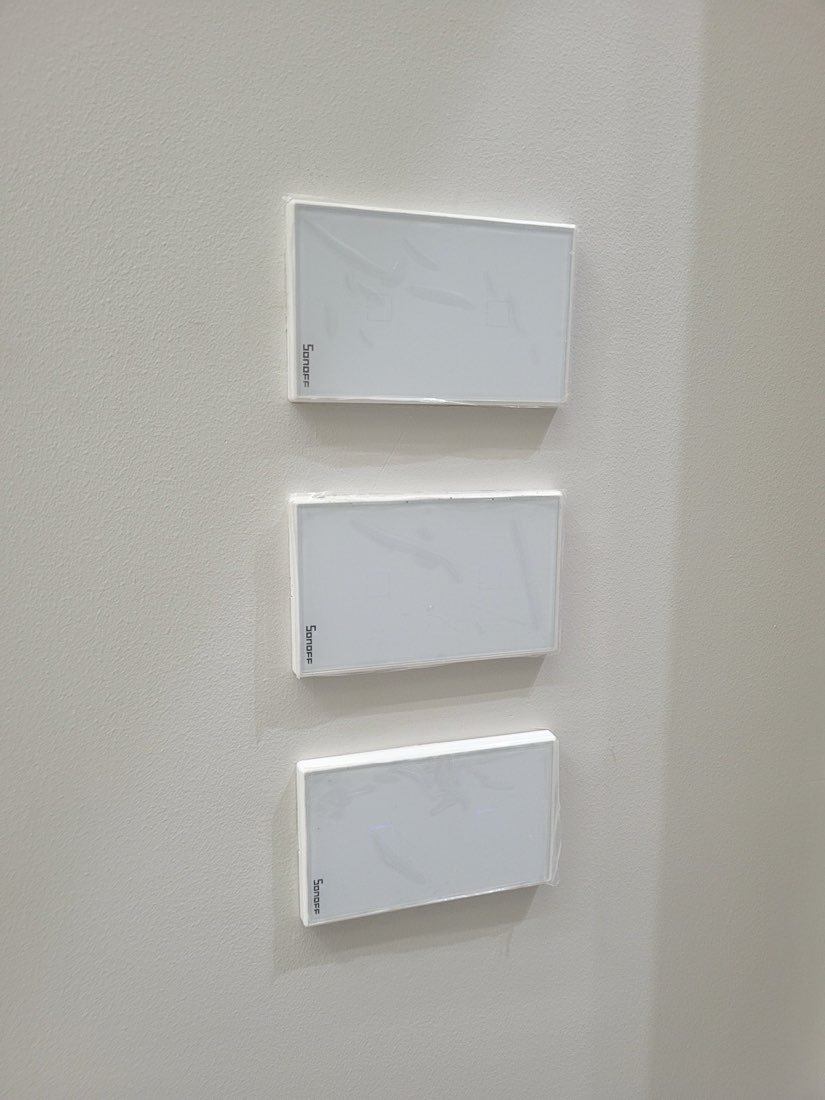 Three-gang smart touch switch panel installed in the hallway