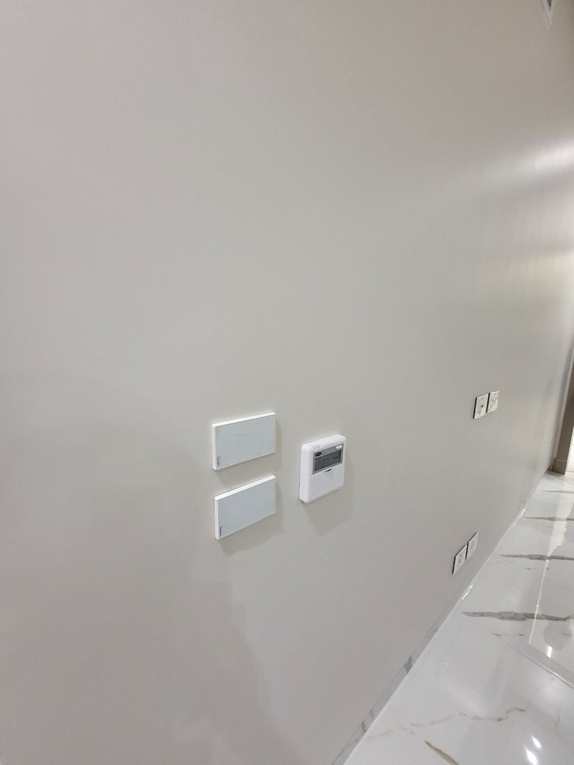 Smart touch switches beside the wall-mounted climate controller